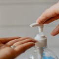 Hand Sanitizer squirting into hand, by Kelly Sikkema