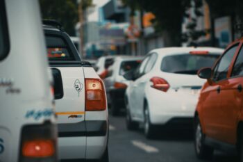 white and orange car on road during daytime