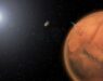 This artist's impression shows ESA’s Mars Express spacecraft scanning the fast-moving shadow of the moon Phobos as it moved across the Martian surface.