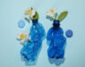 Top view of plastic bottles with flowers